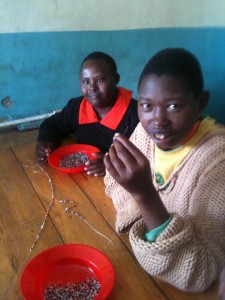Girls producing necklaces